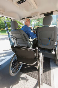 Man with muscular dystrophy and diabetes from inside an accessible van