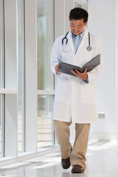 Doctor studying a patient records