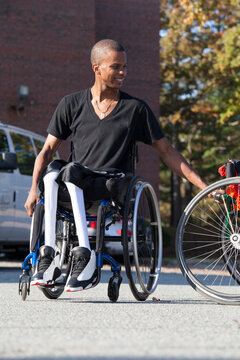 Man who had Spinal Meningitis in wheelchair entering his accessible vehicle