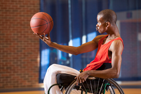 Man who had Spinal Meningitis in wheelchair playing basketball