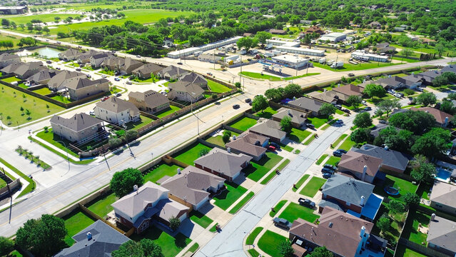 Divided housing sectors appear along Mansfield Webb Rd where South Arlington, Texas neighborhoods transition between largerlot homes denser blocks positioned near commercial buildings open fields