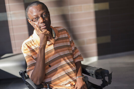 Man with Guillain-Barre Syndrome relaxing in his power chair