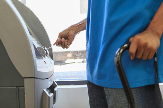 Man with Traumatic Brain Injury using a bank ATM