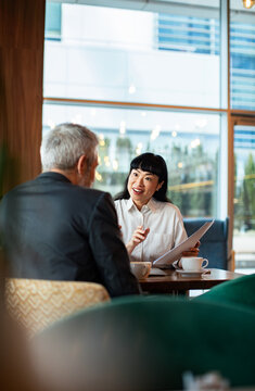 Advisor meeting with client in a modern cafe