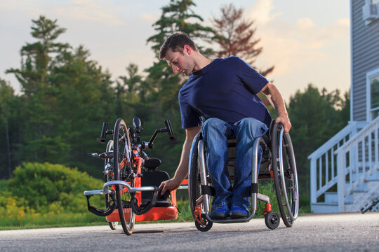 Man with spinal cord injury in his wheelchair with his custom adaptive hand cycle