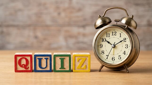 The word QUIZ spelled out with colorful wooden toy alphabet blocks next to a vintage bronze alarm clock on a wooden table, concept for time management, test, or trivia challenge.