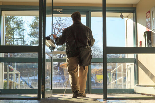 Man with congenital blindness leaving his apartment building