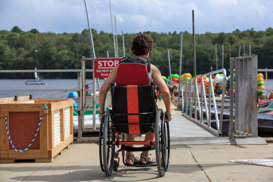 Woman with a Spinal Cord Injury in a wheelchair on a boat dock