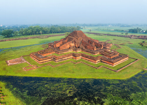 Aerial view of the ancient Buddhist monastery of Sompur Mahavihara with its central cruciform temple structure and green lawns in Naogaon District, Rajshahi Division, Bangladesh.