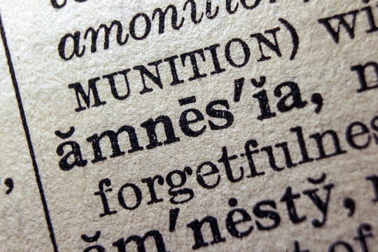 Word amnesia on dictionary page, macro close up