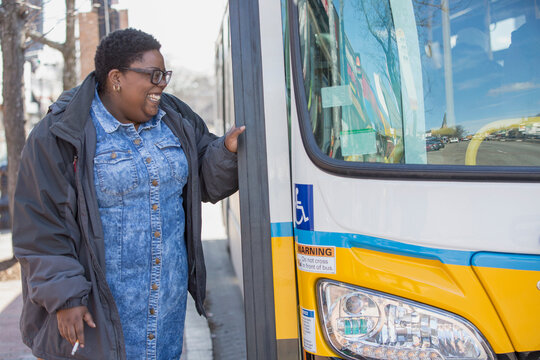 Woman with bipolar disorder about to take a bus and smoking