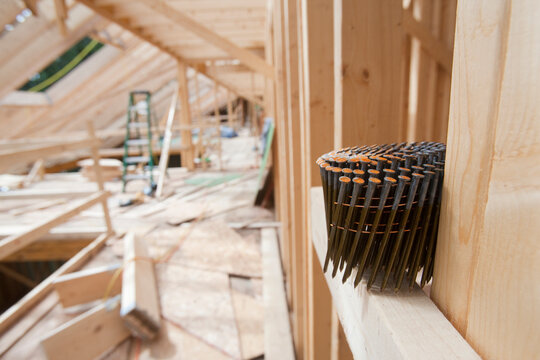 Upper floor of framed house with coil of nails