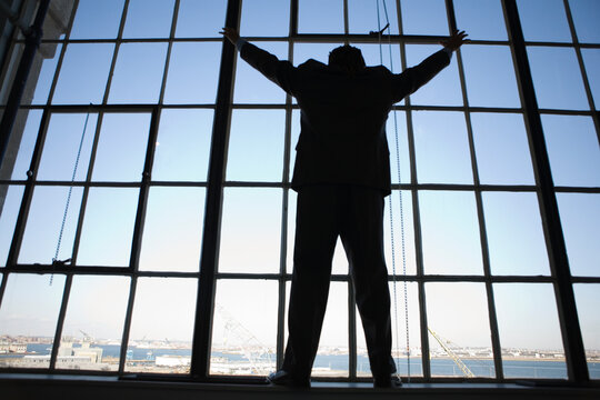 A young man looking out of a window