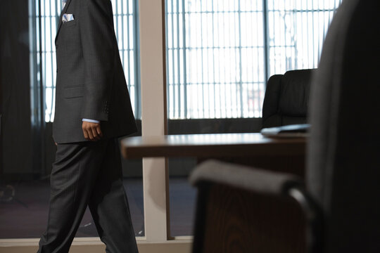 A business man walking in an office