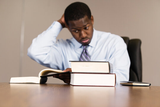 View of business man with books in an office