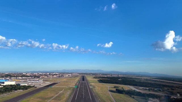immersive pilot&rsquo;s eye recorded from inside. a jet cockpit during the final approach to Madrid aiport in a sunny day with scattered clouds in a blue sky.