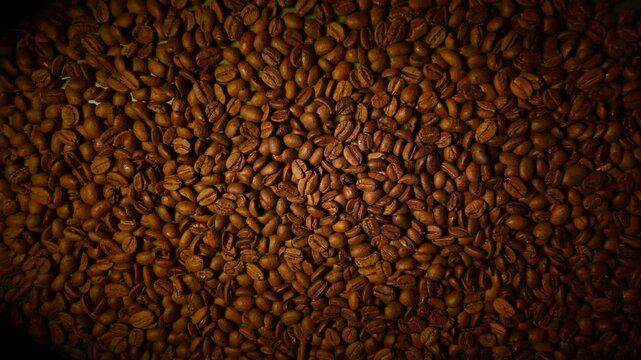 50p macro slider shot moving across roasted coffee beans texture
