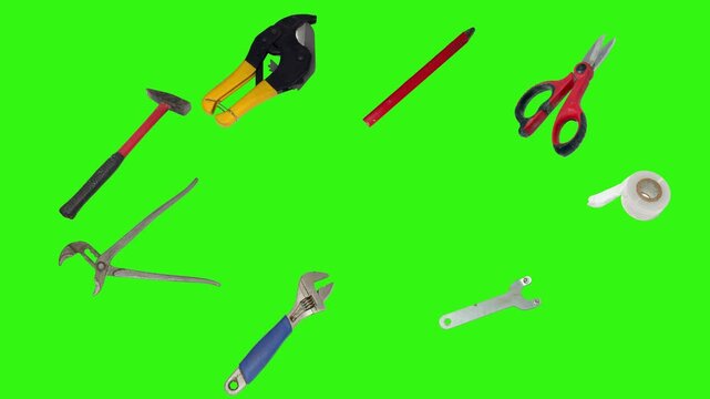 Various plumber tools and supplies falling against a bright green background