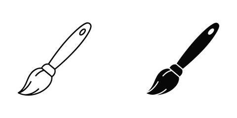 Paintbrush with natural bristles and black handle on a white background for creative design © EliachStock