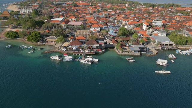 Clear Blue Water Benoa Bay Entrance Local Houses On Waterfront Bali Indonesia Drone Track Right 4K 30FPS