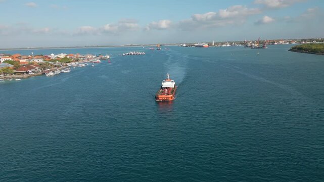 Empty Ship Heads For Open Waters After Leaving Benoa Port Bali Indonesia Drone Circling 4K 30FPS