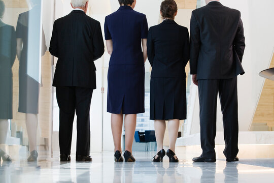 View of businesspeople standing in a corridor