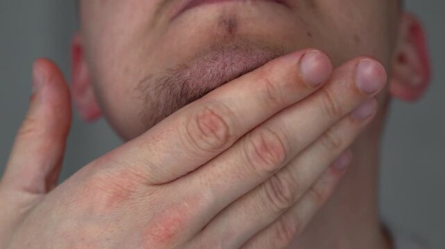 A man with thick stubble on his face