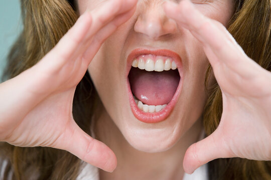 Close-up of a mid adult woman yelling