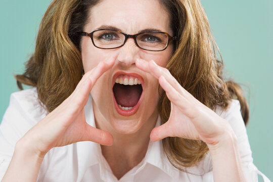 Portrait of a mid adult woman yelling
