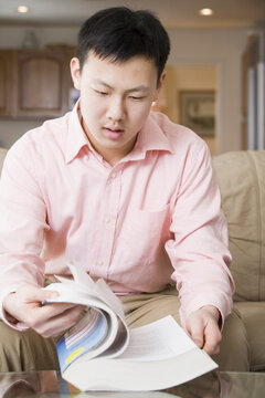 Teenage boy reading a book