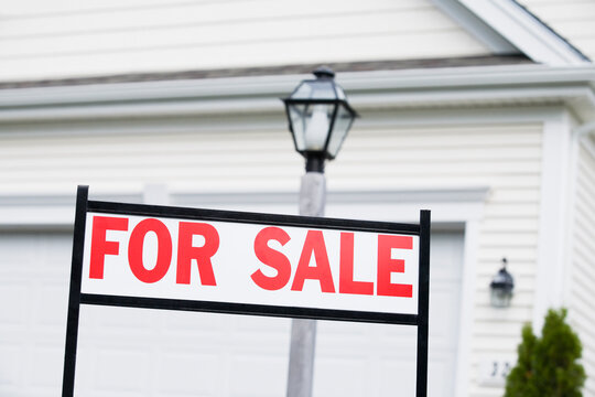 For Sale signboard in front of a house