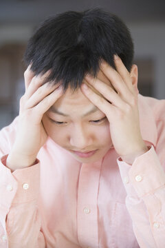 Close-up of a teenage boy thinking