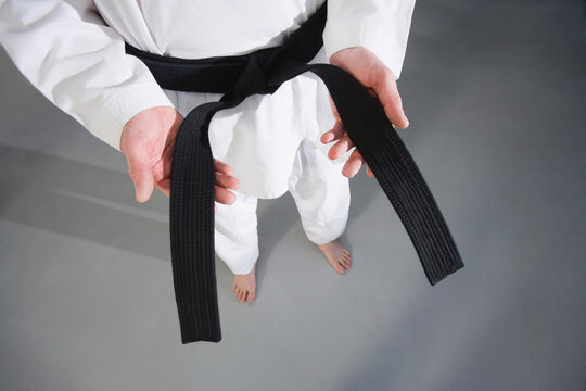 Man showing black belt