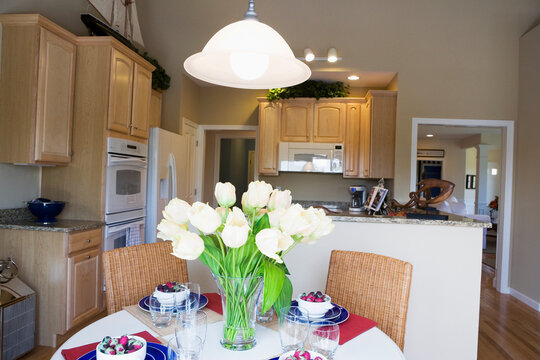 Flowers in a vase on a dining table