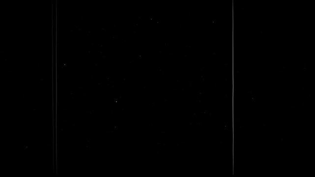 Jittery analog movement and rapid scratches replicating early cinema.