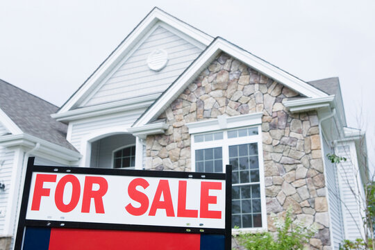 For Sale signboard in front of a house