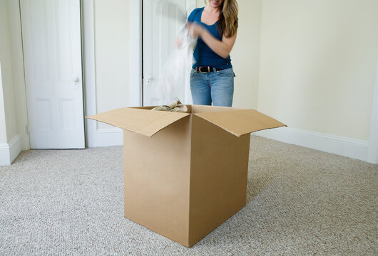 Woman unpacking box