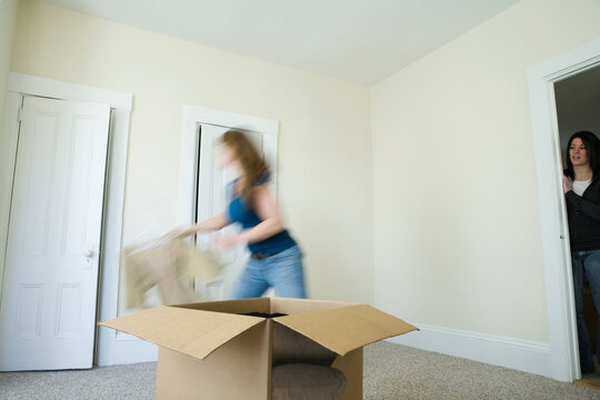 Women in empty room of a house