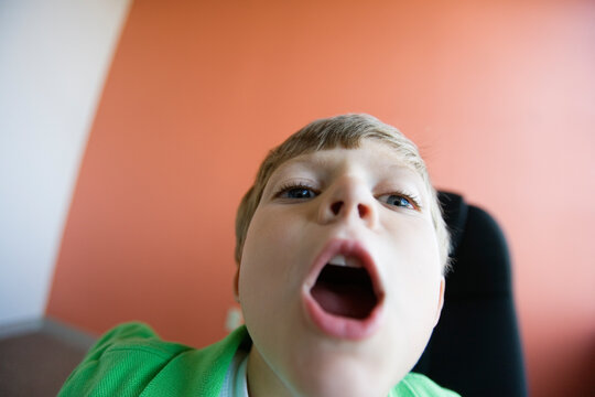 View of a boy making a funny face