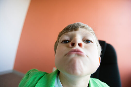 View of a boy making a funny face
