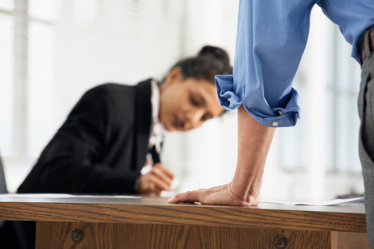 View of a business woman writing in an office
