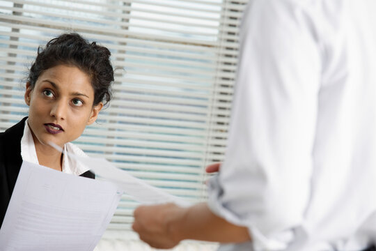 View of a business woman holding a paper