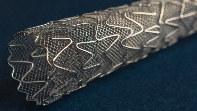 Ultra-fine metallic mesh stent showing intricate lattice on dark blue background.