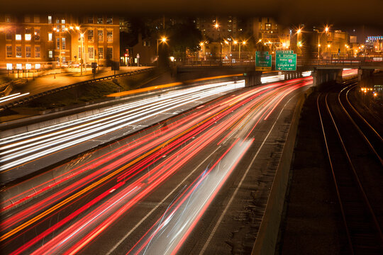 Streaks of lights of moving vehicles on the road
