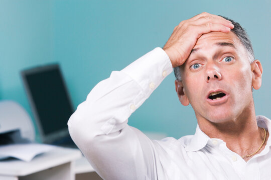 Portrait of a mid adult man looking surprised