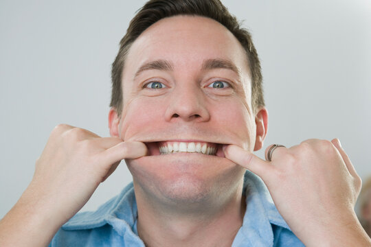 Portrait of a mid adult man making a funny face