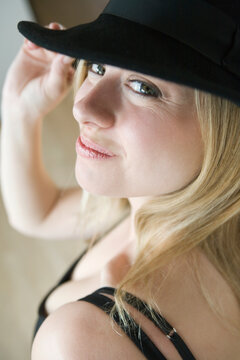 Portrait of a mid adult woman wearing a hat and smiling