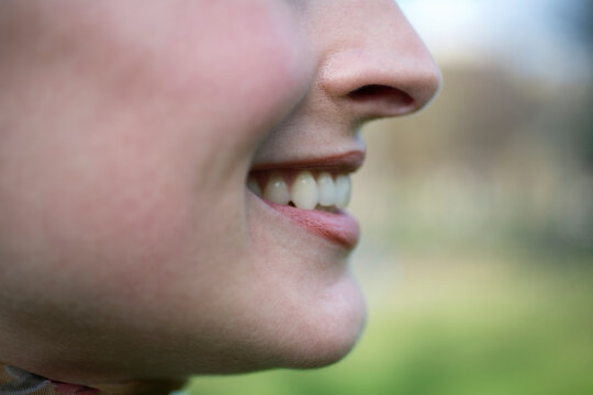 Profile of a young woman smiling
