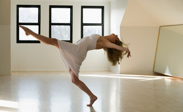 Side profile of a mid adult woman dancing