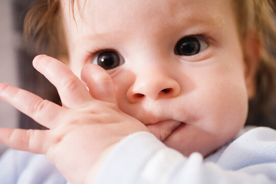 Portrait of a cute child sucking thumb
